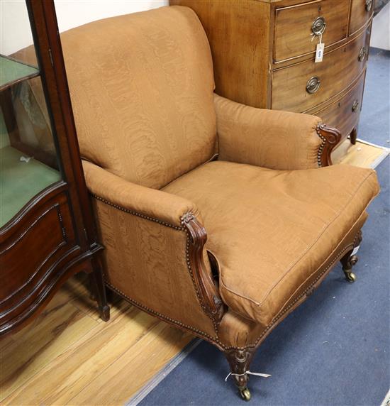 A French walnut club armchair